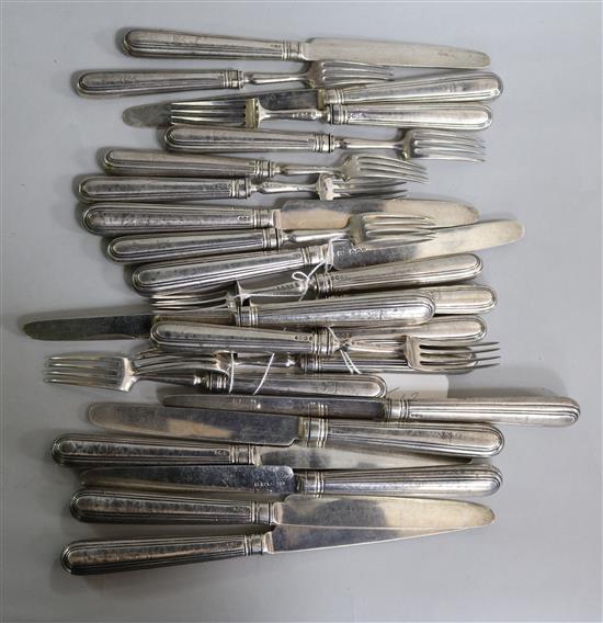 A part matched set of George III silver fruit eaters (11 knives and 12 forks)